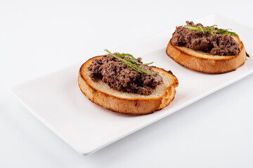 delicious italian bruschetta with truffle pate on white plate - obrazy, fototapety, plakaty