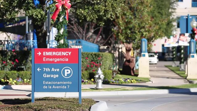 Hospital Emergency Room sign exterior b roll of building from parking lot 