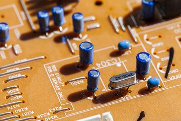 Printed circuit board with capacitors, close up photo