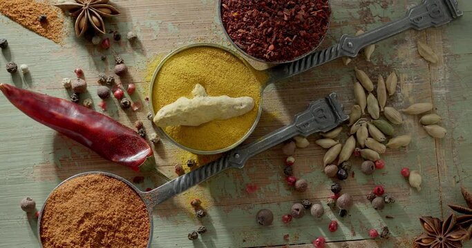 Wooden table of colorful spices. Top view