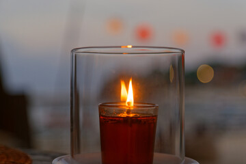 A candle in a glass sending out romantic vibes.