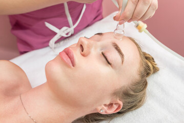 Obraz na płótnie Canvas cupping facial massage, close-up.