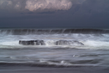 Beautiful morning view in Indonesia. Panorama of the sea and beach waves