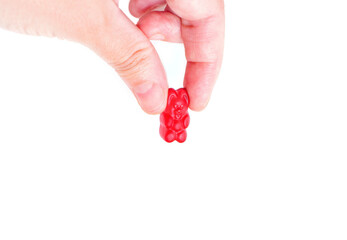 Red gummy bear candy isolated on white