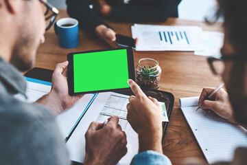 Green screen, copyspace and chromakey on a tablet screen in the hands of a business man in a meeting in a boardroom. Advertising, marketing and online promotion with colleagues pointing at copyspace - Powered by Adobe