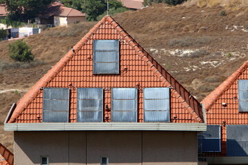 Red tiled roof on a residential building.