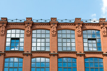 Loft building facade. Windows of the  factory building.