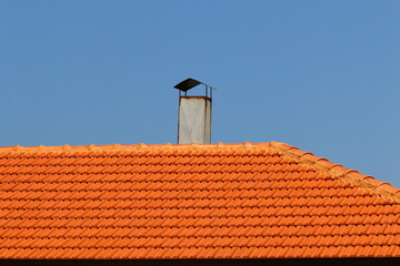 Red tiled roof on a residential building.