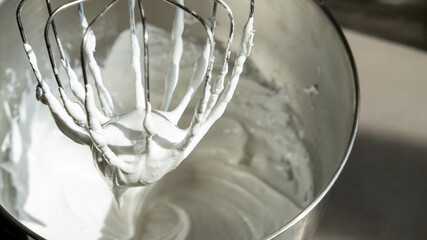 Mixing Whipped Cream in a Stand Mixer with a Whisk Attachment: Heavy whipping cream mixed with a...