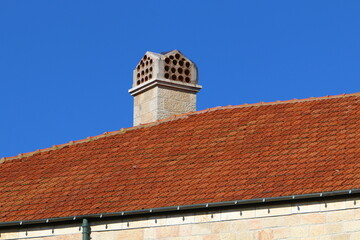 Red tiled roof on a residential building.