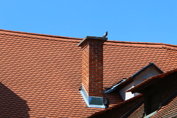 Red tiled roof on a residential building.