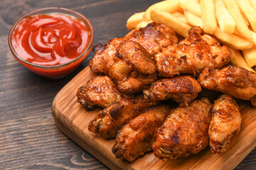 lunch fast food chicken wings with ketchup and potatoes fries