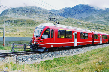 Obraz na płótnie Canvas Swiss mountain train Bernina Express crossed Alps. St.Moritz, Switzerland