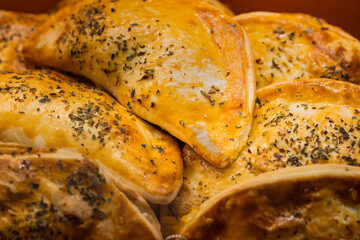 Meat pie with spices at the Boqueria market in Barcelona (Spain).