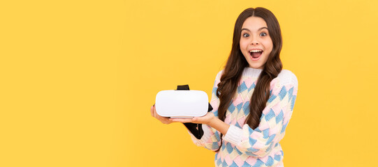surprised teen girl hold vr glasses using future technology for education, vr school. Banner of child girl with virtual reality vr headset, studio portrait with copy space.