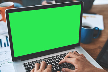 Green screen, copyspace and chromakey on a laptop of a business person typing an email, browsing...