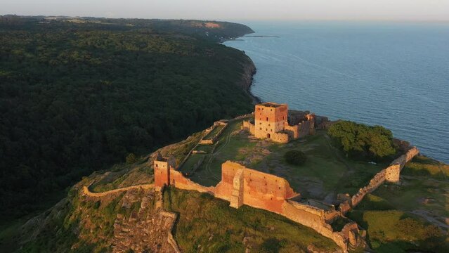 Aerial of Impressive Medieval Fortress of Hammershus Ruins at sunset, Denmark