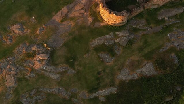 Aerial of Impressive Medieval Fortress of Hammershus Ruins at sunset, Denmark