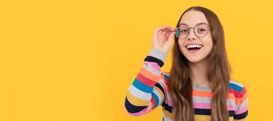 happy schoolgirl nerd kid in eyeglasses for vision, eyesight. Child face, horizontal poster,...
