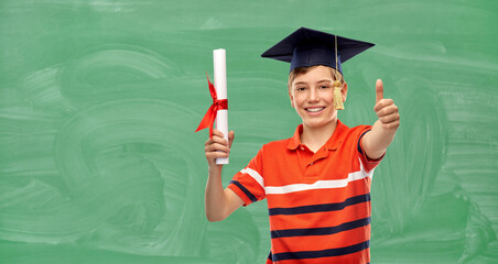 school, education and graduation concept - portrait of happy smiling graduate student boy in...