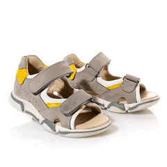 Pair of children's comfortable sports sandals isolated on white background.
