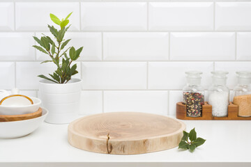 Wood pedestal on table in kitchen interior for product presentation