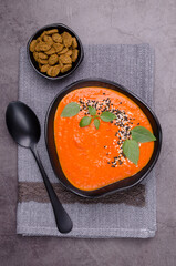 Red cream soup with sesame and basil