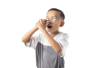 Young Asian boy use magnifying glass, Thai student isolated on white background
