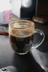 selective focus of a cup of coffee on the table