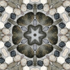 pebble patterns from many grey and white smooth stones arranged to form hexagonal floral fantasy creative designs