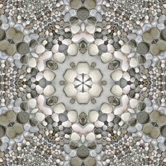 pebble patterns from many grey and white smooth stones arranged to form hexagonal floral fantasy creative designs