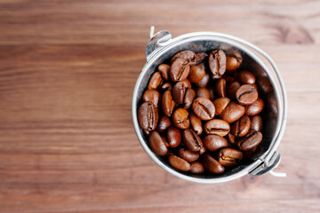 Bucket full of roasted coffee beans