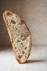 Slice of homemade sourdough bread. Close up. - 522947582
