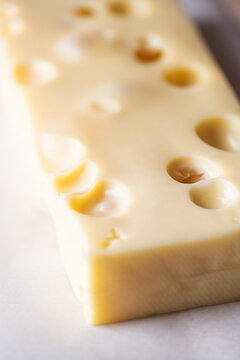 French emmental semi-hard cheese, selective focus.