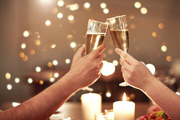 Cheers, toast and celebration for a couple on romantic date night celebrating an anniversary, valentines or a birthday. Closeup of hands holding glasses of champagne, alcohol and booze in restaurant