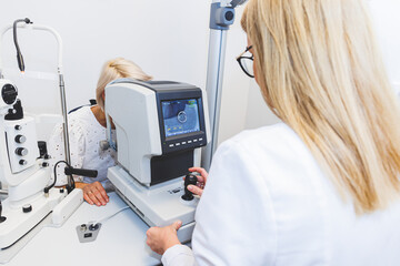 Eye doctor checking vision with modern equipment. Eye examination