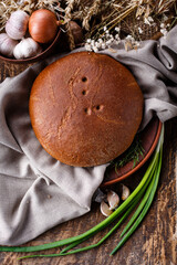 Close up of rye bread on rustic background. Homemade bread.