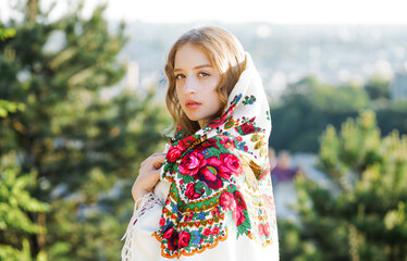 Portrait of a serious blonde in traditional national clothes.