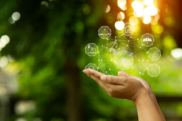 Technology, hand holding with environment Icons over the Network connection on green background