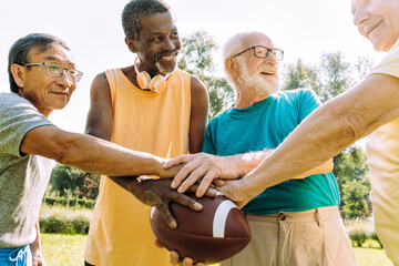 Group of senior friends playing at the park