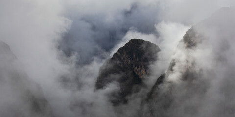 Morning mountains Andes in fog and clouds around Machu Picchu, Peru - obrazy, fototapety, plakaty