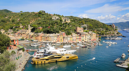 Fototapeta na wymiar Colorful buildings and yachts in Marina di Portofino, Italy