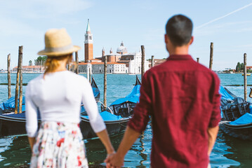 Young couple in Venice. Lifestyle travel moments in the beautiful italian city. Concepts about Venezia © oneinchpunch