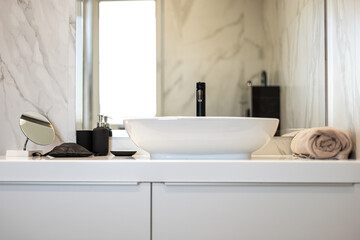 Fototapeta na wymiar Modern washbasin with chrome faucet