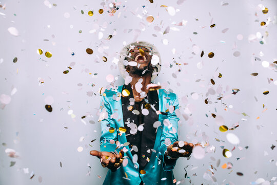 artistic portrait with gel lights. Handsome man posing on colored backgrounds. Artist singer performer posing for the album cover