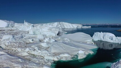 Fototapeta na wymiar Greenland. Icebergs in Disco Bay. Landscapes of polar nature.