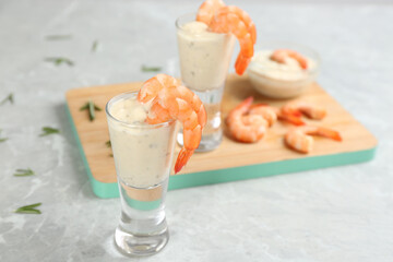 Shrimp cocktail and tartar sauce on marble table