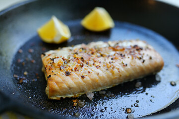 Salmon Fillet Steak In A Pan With Lemon Slices