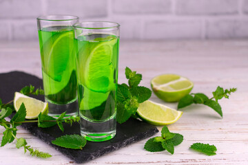 Alcoholic mint liquor with lime.Copy space.
