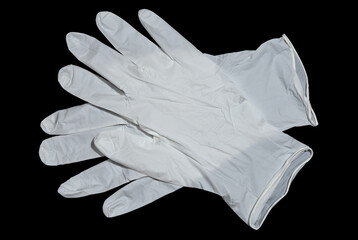 White medical gloves on a dark background